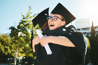 Buy stock photo Hug, graduation and students smile, success for achievement and happy outdoor in gown. Female graduate, embrace and completed degree for education, certificate and diploma at university and college.