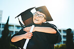 Hug, graduation and students success for achievement, happy and smile outdoor in gown. Graduate, happiness or embrace for degree, certificate and education completed at university, college or diploma