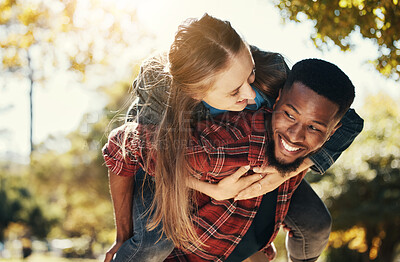 Buy stock photo Love, piggy back and couple in park walking, smile and happy together, for bonding and outdoor. Romantic, interracial man and woman or loving on spring vacation, holiday and romance for relationship