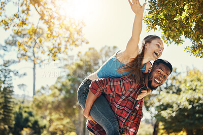 Buy stock photo Diverse, couple and piggyback fun with a man and woman having fun in nature during summer. Adventure, happy couple and interracial people in a green garden or natural environment with happiness