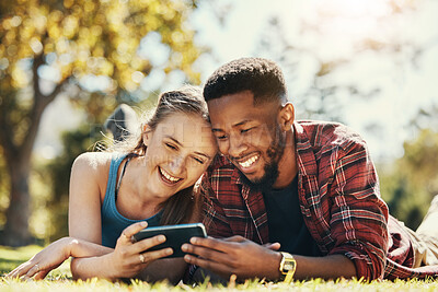 Phone, park and relax diversity couple streaming online comedy movie, funny  subscription video or romantic show. Love, freedom peace and bonding black  man and woman watch social media meme on date |