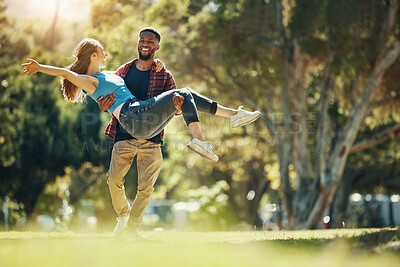 Buy stock photo Crazy couple, carry and happy smile, fun and enjoy date in nature park, romance and care while running together. Interracial man, woman and love with happiness, freedom and energy in garden or forest