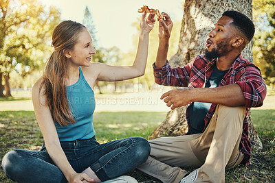Buy stock photo Relax, pizza and happy with couple in park for picnic, fast food and summer date. Love, youth and freedom with black man and woman eating lunch in grass for nature, smile and bonding together 