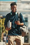 Student, education and phone with a black man university pupil walking on campus while typing a text message. Social media, communication and contact with a male at college reading on his smartphone