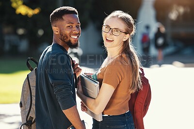 Buy stock photo Education, university and students with couple who are interracial on campus for academic and learning. Black man, woman and smile in portrait with books to study, outdoor and college life.