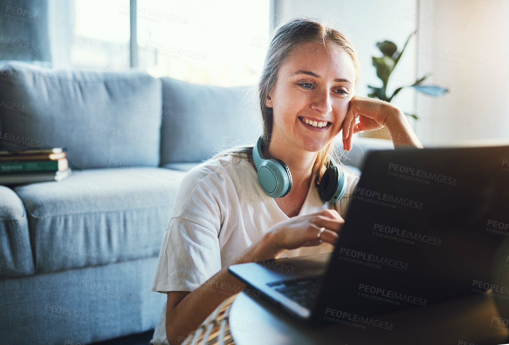 Buy stock photo Education, laptop and elearning with a woman student studying online in the living room of her home. Learning, computer and virtual class with a female pupil reading study material in the house