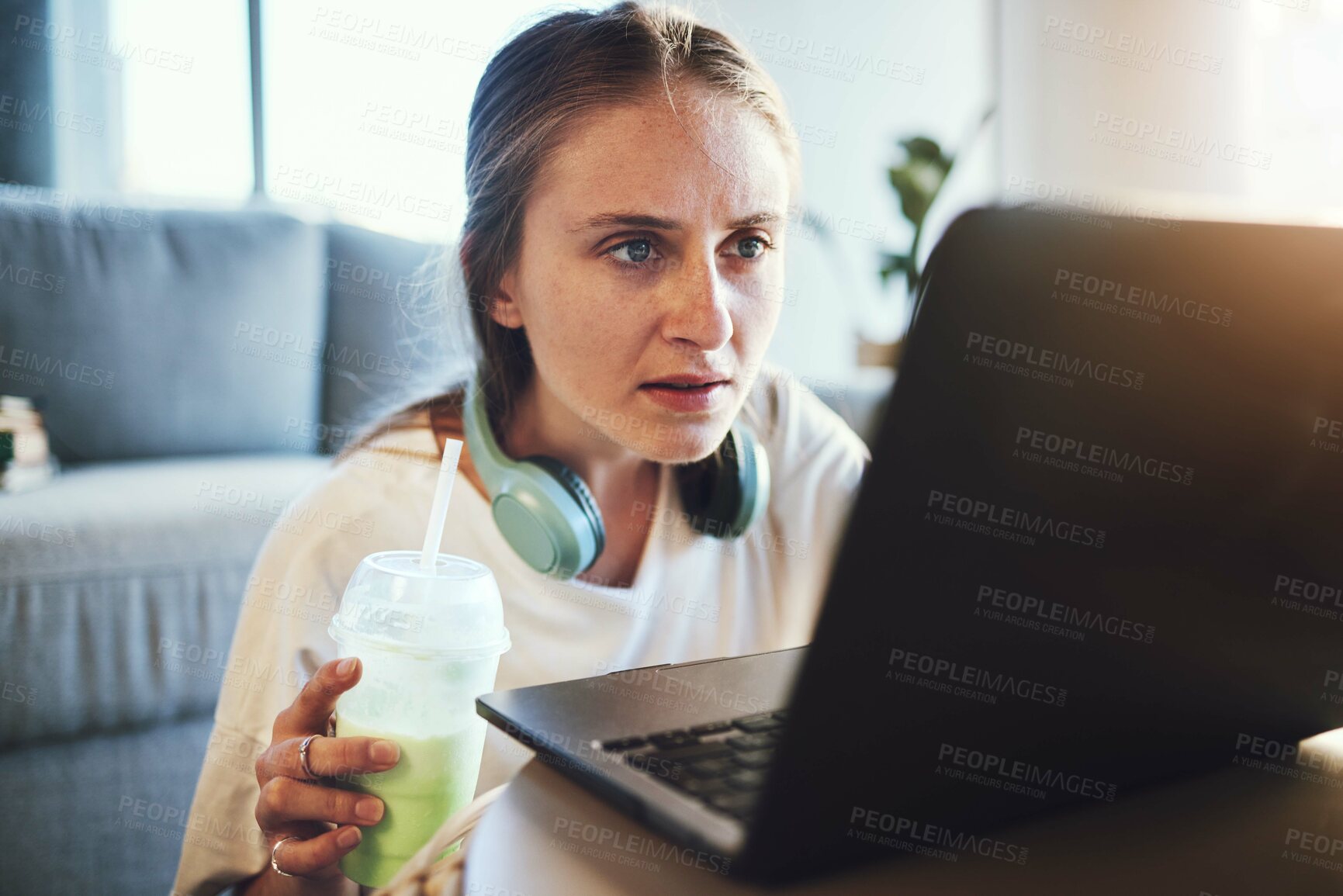 Buy stock photo Laptop, smoothie and blog with a woman freelance entrepreneur doing remote work from home online. Computer, detox and email with a female blogger working in the living room of a house with headphones