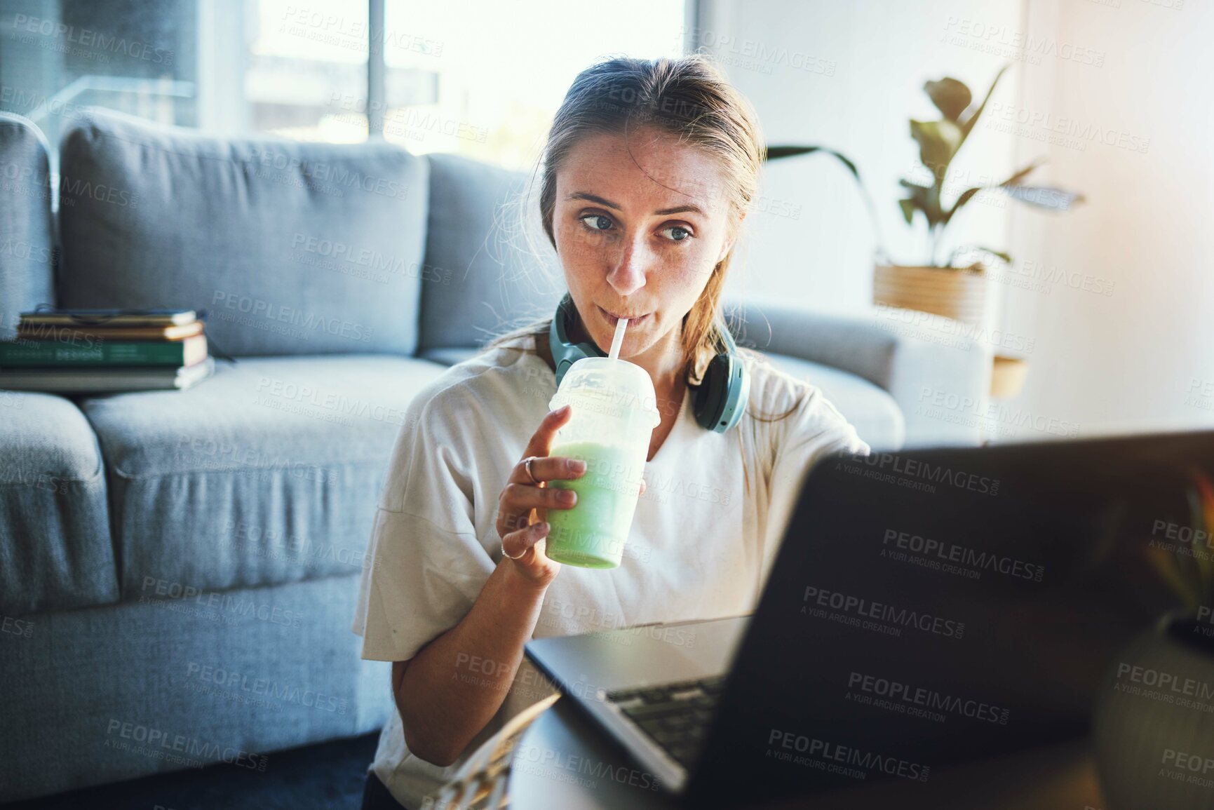 Buy stock photo Student, laptop and smoothie for education, digital elearning and research for college in living room. University, studying and school woman, working on email, project or online exam with drink