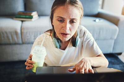 Buy stock photo Laptop, student and confused woman in home working online, studying and busy with project. Education, college and stressed girl with smoothie in living room doing work, research and task on computer