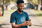 Happy, black man and smartphone in city, for communication and outdoor for social media. African American male, smile and cellphone for chatting, browse online and search internet with happiness.