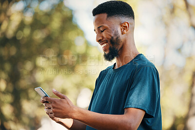 Buy stock photo Black man with smartphone, communication outdoor with technology, message or email with 5g network in nature. Online, social media and internet connection, check cellphone and smile at meme or text.