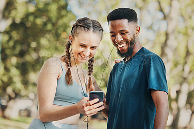 Buy stock photo Phone, music and fitness with a diversity couple streaming audio while running in the park for exercise. Nature, social media and workout with a sports man and woman listening to the radio together