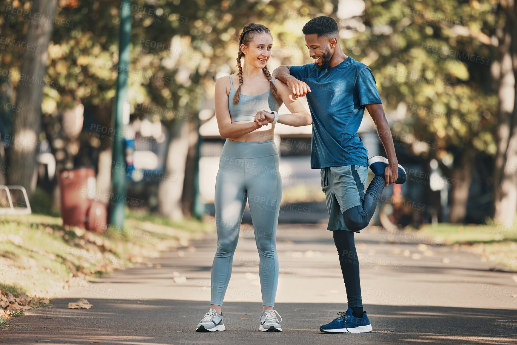 Buy stock photo Interracial, couple and stretching for training, wellness and exercise to relax and workout in park. Health, man and woman outdoor for practice, fitness and together for bonding, healthy and talking.