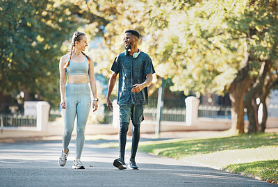 Buy stock photo Workout, fitness and couple walk in nature together for wellness, bond and health in summer. Exercise and healthy lifestyle of people in interracial relationship walking in New York park. 

