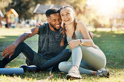 Buy stock photo Couple, fitness and sitting on grass, park or lawn together in sunshine for fitness, wellness and health. Interracial relationship diversity or black man with woman, relax or rest at outdoor training