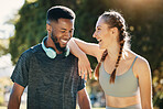 Fitness, laugh and fun with a diversity couple outdoor for exercise together in a park during summer. Sports, workout and training with a man and woman runner outside for health, cardio or endurance
