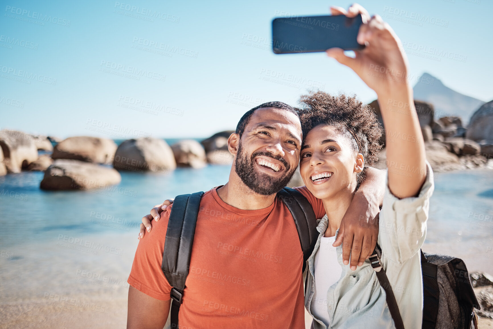 Buy stock photo Couple, love and phone selfie on beach for travel adventure or summer vacation. Happy man, woman smile and photography for holiday lifestyle on 5g smartphone for social media at ocean  water outdoors