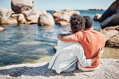 Buy stock photo Couple, love and hug on beach for relax travel vacation together or bonding on ocean sand with summer sunshine. African man, woman and calm holiday or loving romance date by the sea water outdoors
