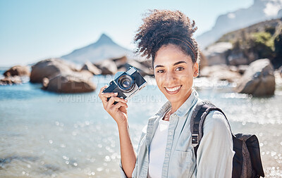 Buy stock photo Black woman, beach photographer and camera on ocean travel holiday, adventure by the sea and summer vacation. Portrait of freelance photography professional, tourist by the seaside and girl in nature