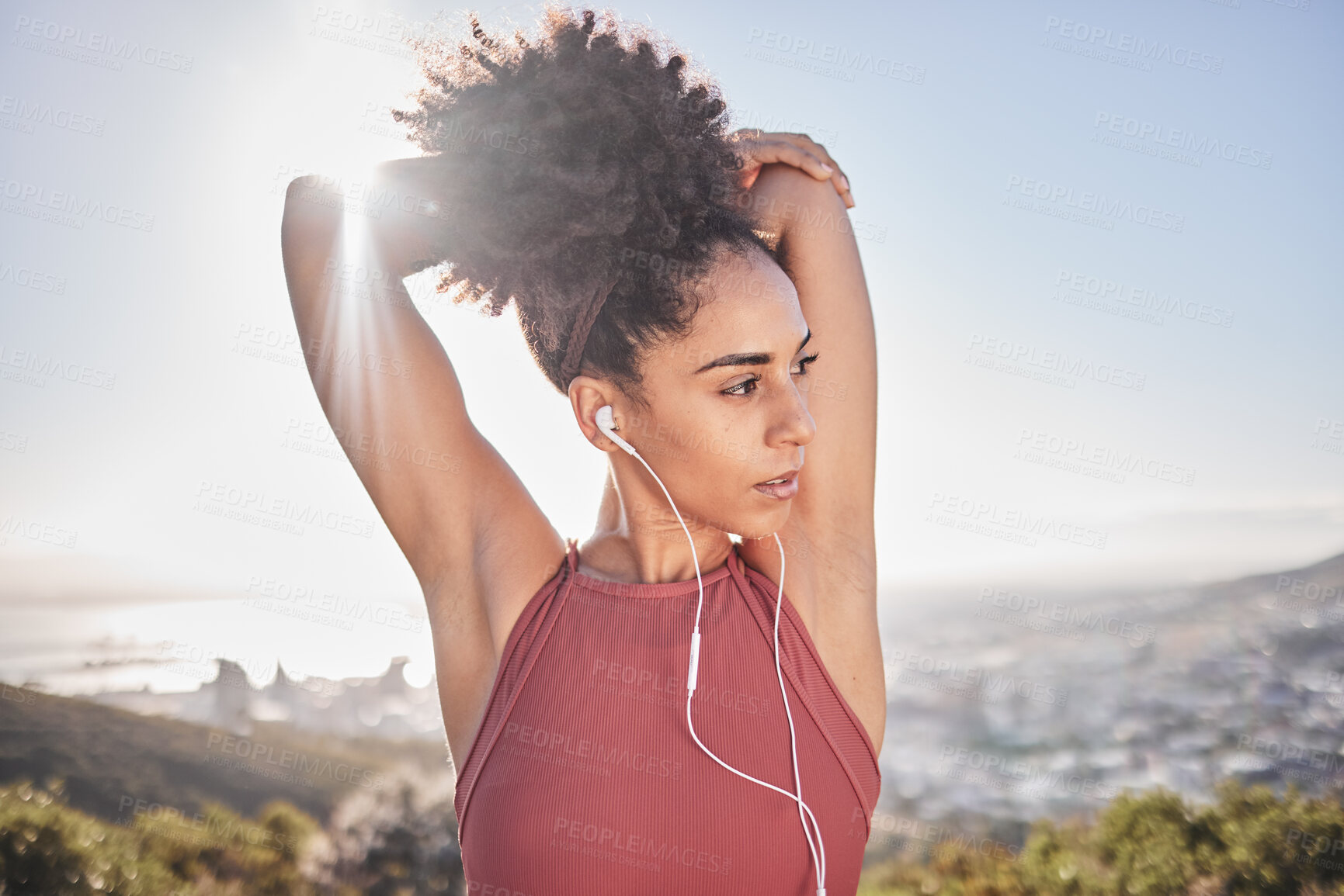 Buy stock photo Fitness, stretching and black woman with headphones in city for warm up to start running. Wellness, health and girl doing workout, stretch and exercise on mountain listening to music, track and audio