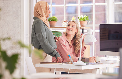 Buy stock photo Office, business people and women talking at desk, conversation or speaking. Meeting, discussion and manager, leader or ceo chatting with employee, coworker or worker on break at company workplace.