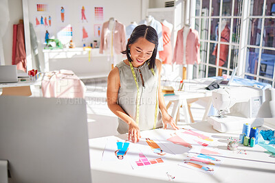 Buy stock photo Fashion designer, drawing and asian woman, creative sketch of clothes and industrial tailor manufacturing in textile startup studio. Happy woman, artist and illustration, paper and color swatch ideas