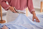 Fabric, fashion designer hands and textile scissor of a black woman working on clothing design. Creative studio, entrepreneur and sewing seamstress busy with planning a boutique and clothes style