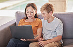 Mother, son and laptop watching movie, online and subscription, relax and happy on sofa together in home. Mom, boy and bonding, social media and fun while browsing internet and funny meme or post