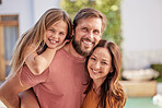 Bonding, happy and parents with child in the garden of their family home for summer, smile and relax. Real estate, peace and portrait of a girl kid with mother and father in the backyard of the house