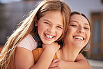 Happy, smile and portrait of a mother and child bonding, embracing and playing together at their house. Happiness, love and young girl kid hugging mom with loving, positive and caring embrace at home