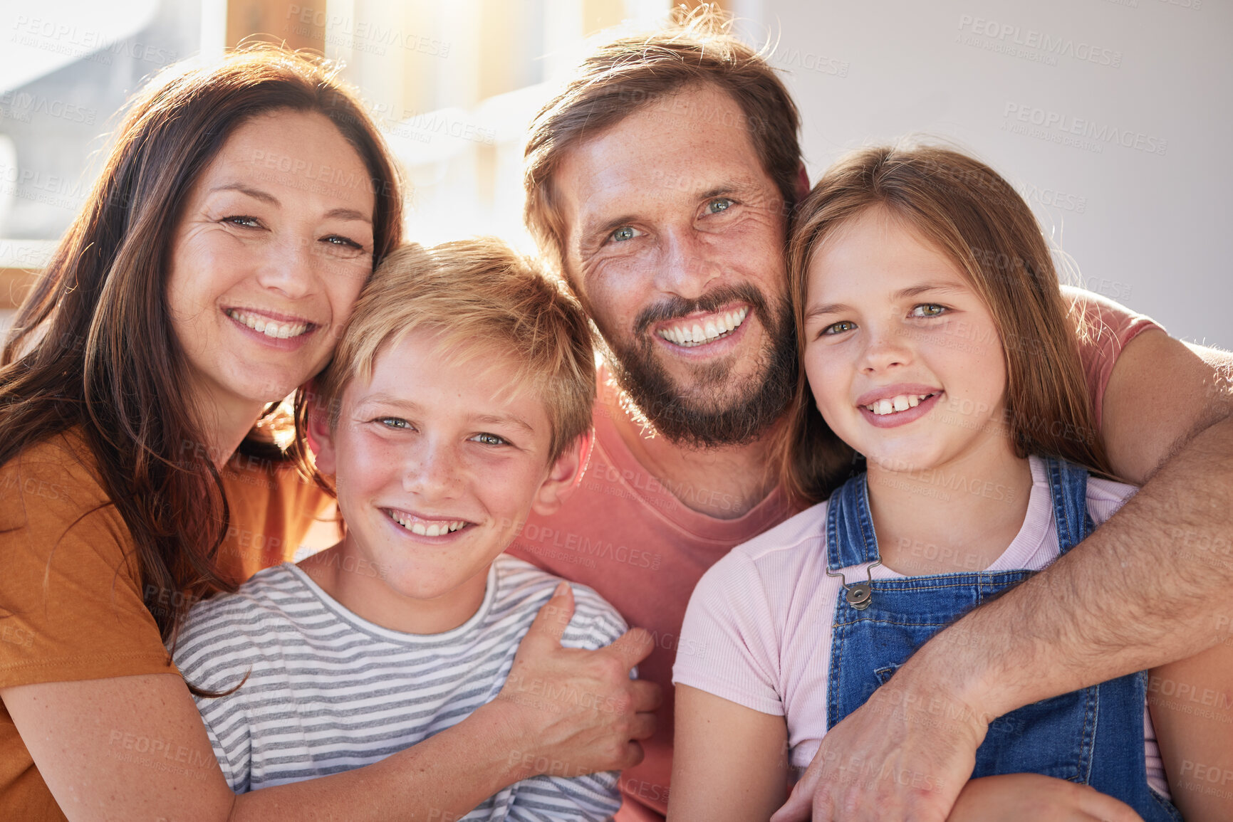 Buy stock photo Happy family, kids and parents, portrait and love, living room and relax, bonding and care, quality time and together in Australia house. Mother, father and children in family home, hug and happiness