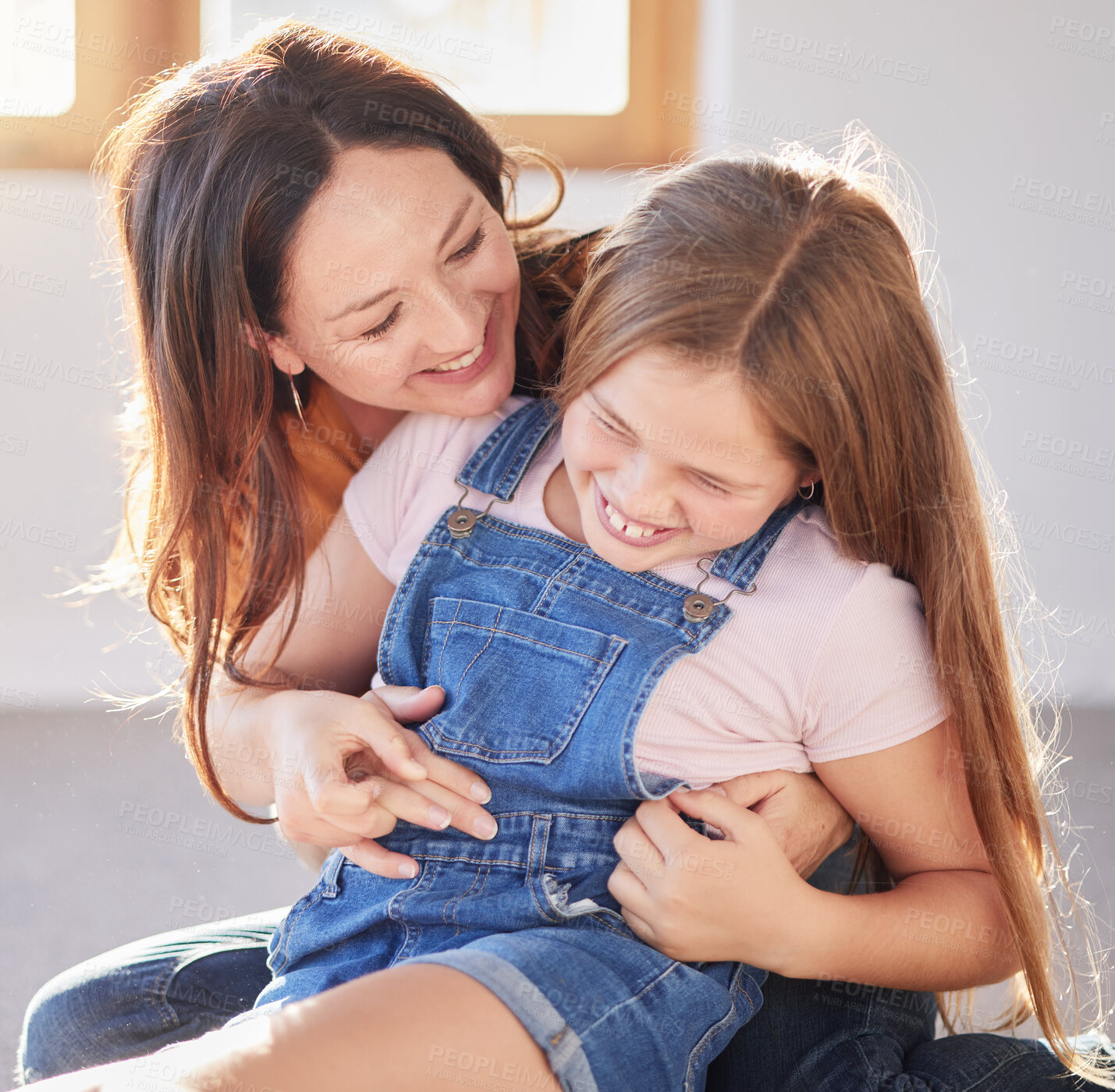 Buy stock photo Happy, love and mother bonding with her child while playing, laughing and relaxing together at their home. Happiness, smile and woman being playful with her girl kid in their modern house in Canada.