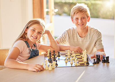 Buy stock photo Portrait, chess and children relax at a table with board game,  bond and learning in a living room in their home. Kids, chessboard and brain activity by girl and boy playing, planning and thinking 