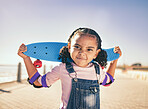 Skateboard, portrait and girl child at the beach promenade for skating practice on an outdoor promenade. Sports, training and kid with comic face while skateboarding by the ocean on seashore vacation