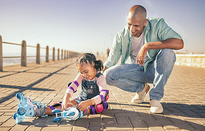 Buy stock photo Father, child and skate learning of a dad and girl outdoor by the sea promenade in summer. Safety check, happiness and bonding together of a man and kid with love and care ready for beach skating