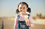 Girl, child and eating ice cream in city, street or urban road outdoors. Happy, smile and black kid enjoying fresh delicious gelato or dessert on a hot summer day, smiling and having fun time alone.