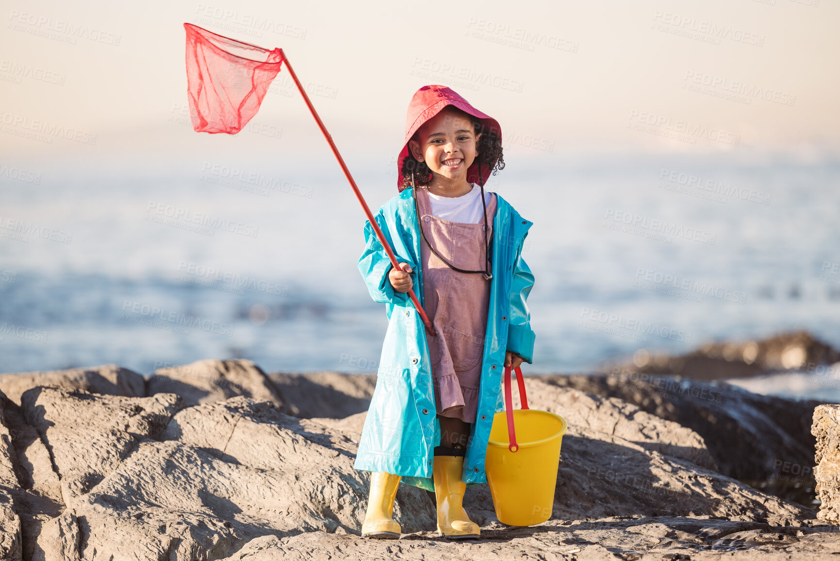 Buy stock photo Child, kid or girl portrait with fishing bucket and net at  beach, ocean or sea to fish in summer. Happy black child outdoor learning for salt water shrimp, crabs or fish with smile in holiday