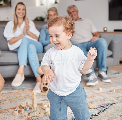 Buy stock photo Kid, building blocks and happy family in living room home, lounge and house of creative learning, growth and development. Toddler boy child play with educational wooden toys, games and montessori fun