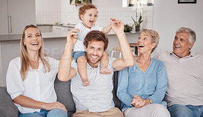 Buy stock photo Playful, portrait and big family on the living room sofa during a visit from grandparents. Love, smile and baby bonding with his parents and senior man and woman on the couch in happiness together