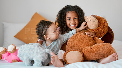 Buy stock photo Children, baby girl and siblings bonding with teddy bear on house, family home or orphanage bed and support, security or comfort trust toy. Smile, happy and playful kids with stuffed animal in foster