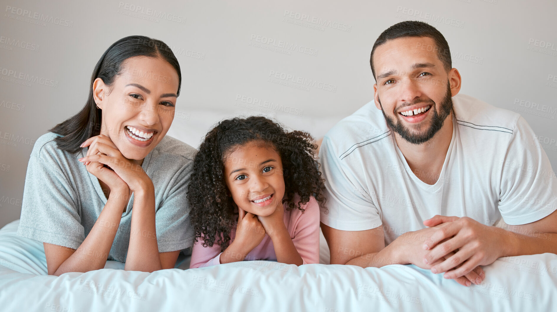 Buy stock photo Black family, bed and face portrait of relax mother, father and girl bonding, at peace or enjoy calm quality time. Love, child care and happy family morning of mom, dad and youth kid in hotel bedroom