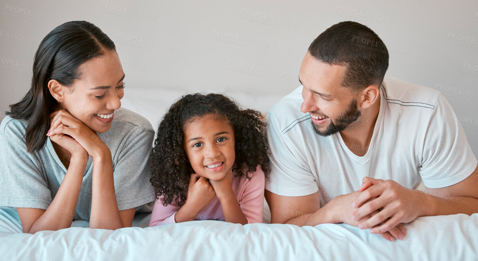 Buy stock photo Family, portrait and home with a parents relax and resting with their little girl in the family home. Mother, father and daughter for caring, loving and bond relationship in the bedroom 