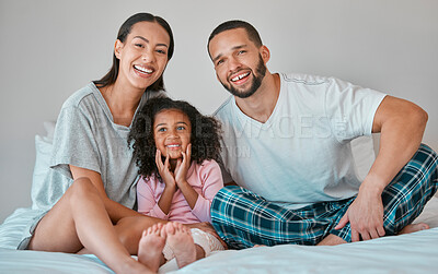 Buy stock photo Dad, mom and child relax on bed together with happy smile, morning peace and bonding in bedroom of home. Portrait of family love, mother and girl kid hug with father for support, security and caring 