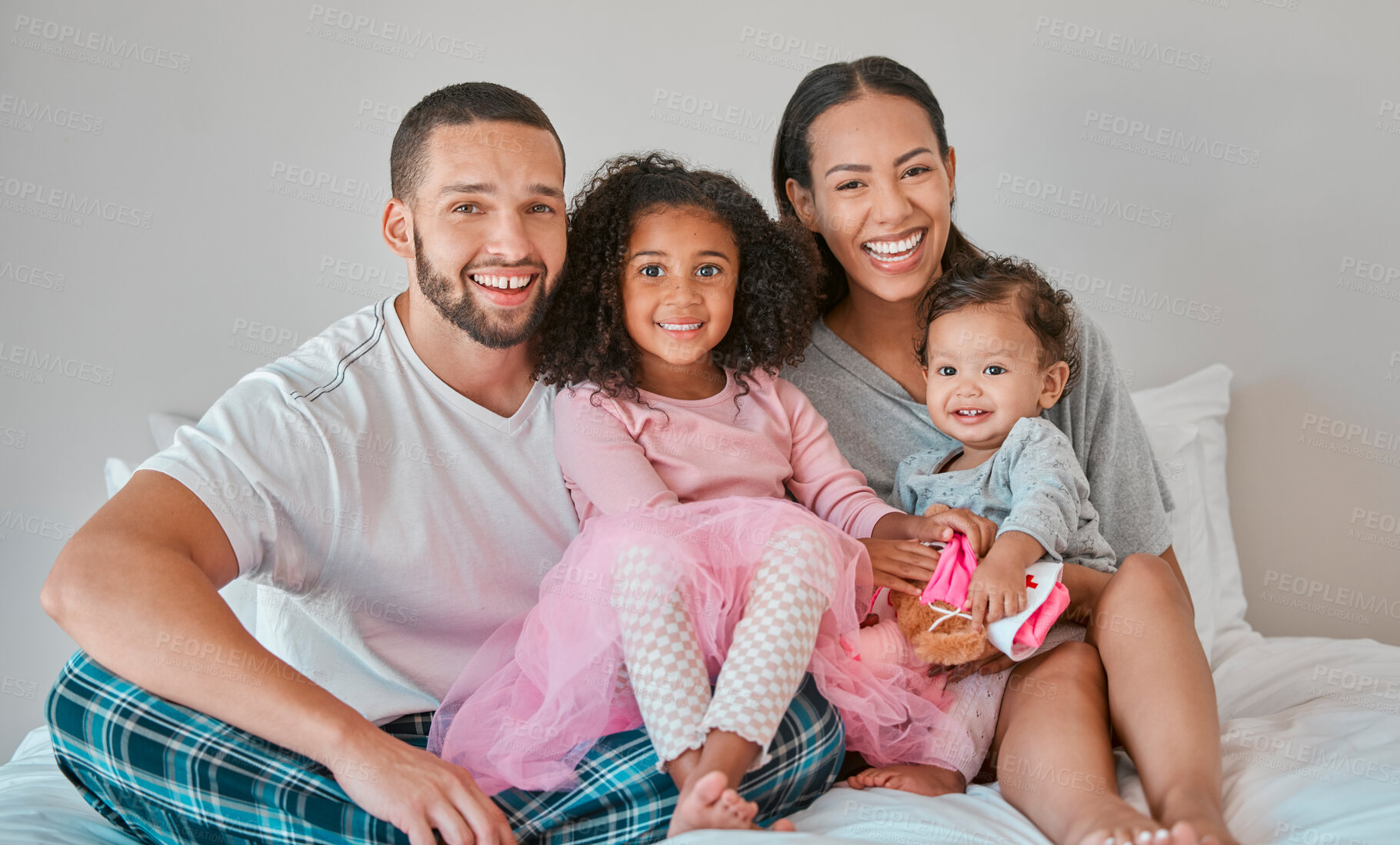 Buy stock photo Family, portrait and bedroom relax for bonding, love and care with girl children on the home bed. Mother, father and sisters or siblings bond with parents in loving relationship in childhood