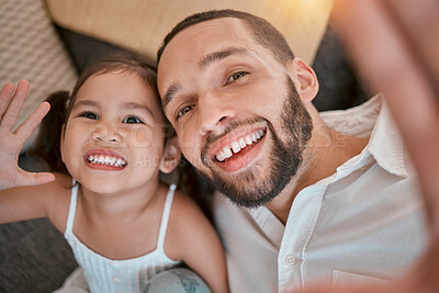 Buy stock photo Happy, child and father take a selfie for a social media memory with a smile on their faces relaxing at home on a sofa. Happiness, papa and fun young girl toddler love taking pictures as a family