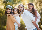 Family portrait, piggy back and love in park, happy smile and care together in nature park together in summer. Mother, father and girl kids, holiday and happiness with care, support or bond in forest