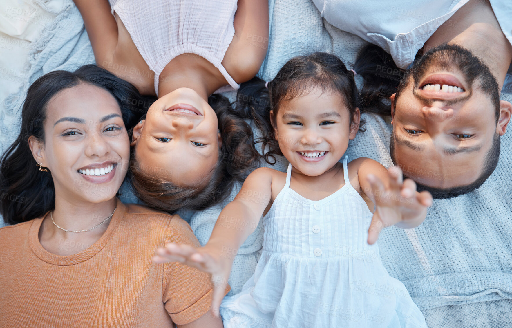 Buy stock photo Family, children and love with a mother, father and girl siblings lying on the ground together from above. Kids, floor and happy with a woman, man and daughter sisters bonding while outdoor to relax