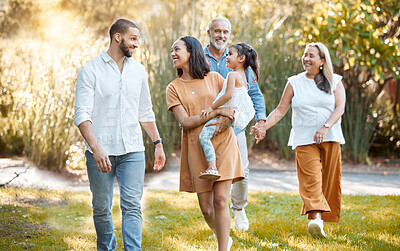 Buy stock photo Big family, walking in a nature park and happy smile with black people walking on grass in summer sunshine for bonding, love and quality time together. Grandparents, father with mother and daughter 
