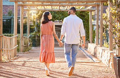 Buy stock photo Couple, holding hands and outdoor on travel date for love, care and happiness together in nature park while talking, bonding and walking in summer. Man and woman having conversation about marriage