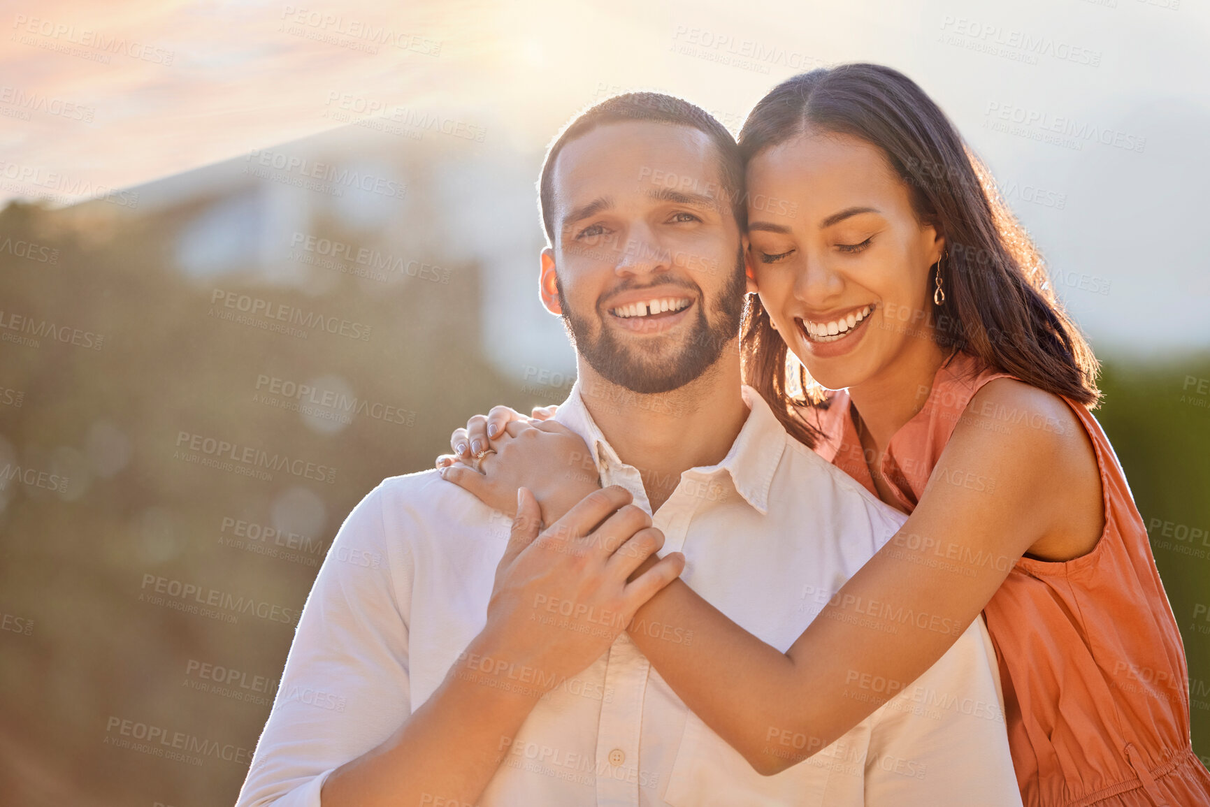 Buy stock photo Love, sunshine and portrait of couple in park enjoying summer holiday, vacation and weekend. Bonding, affection and happy young man and woman hugging, embrace and smiling together on romantic date